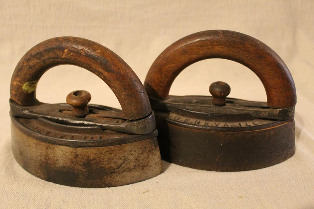 Pair Howell Co Antique Sad Irons: Pair of Howell Co, Geneva, Ill. sad irons. Both iron are in good general condition with some wear to handles. Dimension 3 1/2"W x 7"L x 5"H.