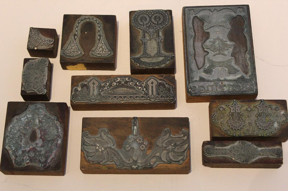 Jacob Elshin Christmas Letterpress Print Blocks: 4 1/8" x 2 7/8"; smallest 1" x 1 1/8".Group of 10 etched metal on wood blocks in Christmas / Russian style. From the estate of Seattle artist Jacob Elshin (1892-1976). Lot includes newly pressed print