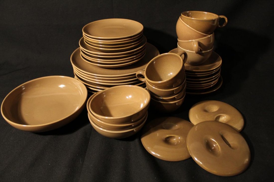 Russel Wright Iroquois Casual Nutmeg Brown: Good condition with various signs of use. Includes 8 dinner plates, 5 salad plates, 5 bread plates, 1 serving bowl, 3 bowls with lids, 1 large saucer (7 3/8" dia.), 8 saucers, 8 cups (one slightly dif