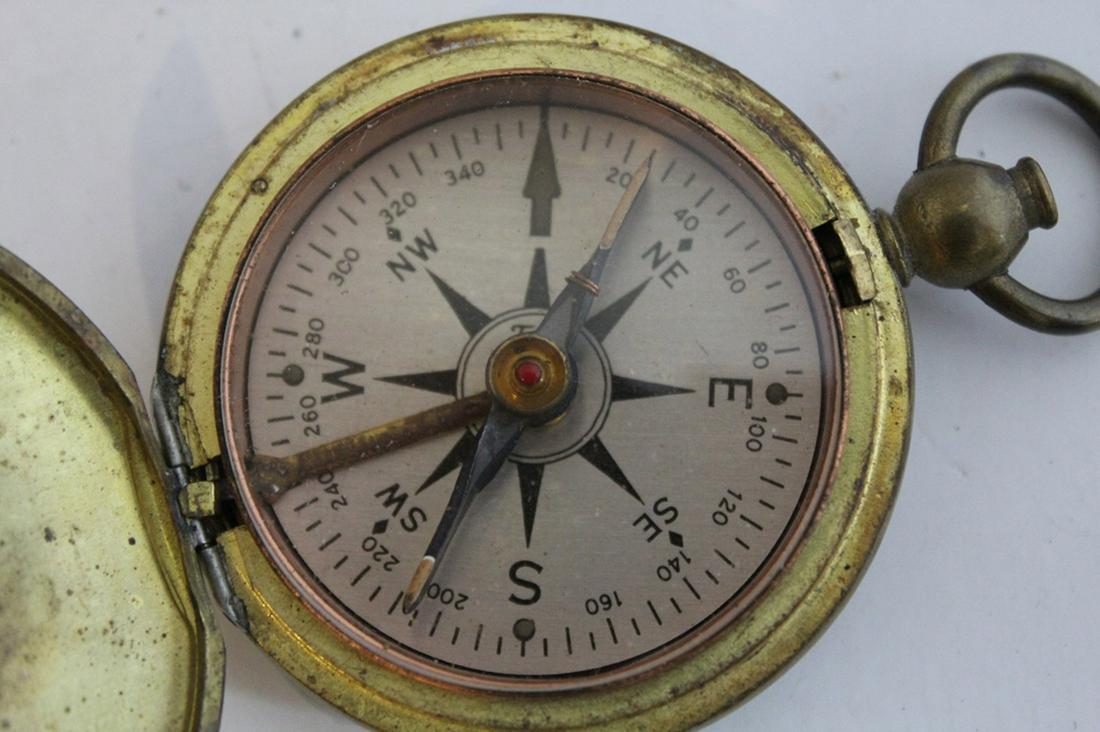 US Corp of Engineers Brass Pocket Compass: US Corp of Engineers (U.S.C.E) brass pocket compass. In good working condition with small dent to back. Dimension 1 3/4"D.