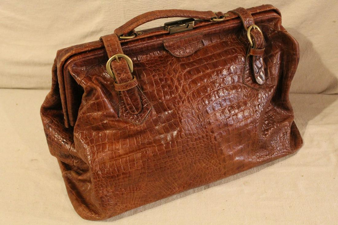 Original Leather Line New York Satchel Travel Bag: Doctor's bag style with two belts. Leather with faux alligator texture. Satin cloth interior. "The Original Leather Line Est. Long Ago New York" label. Brass hardware and lock (includes key). Good con