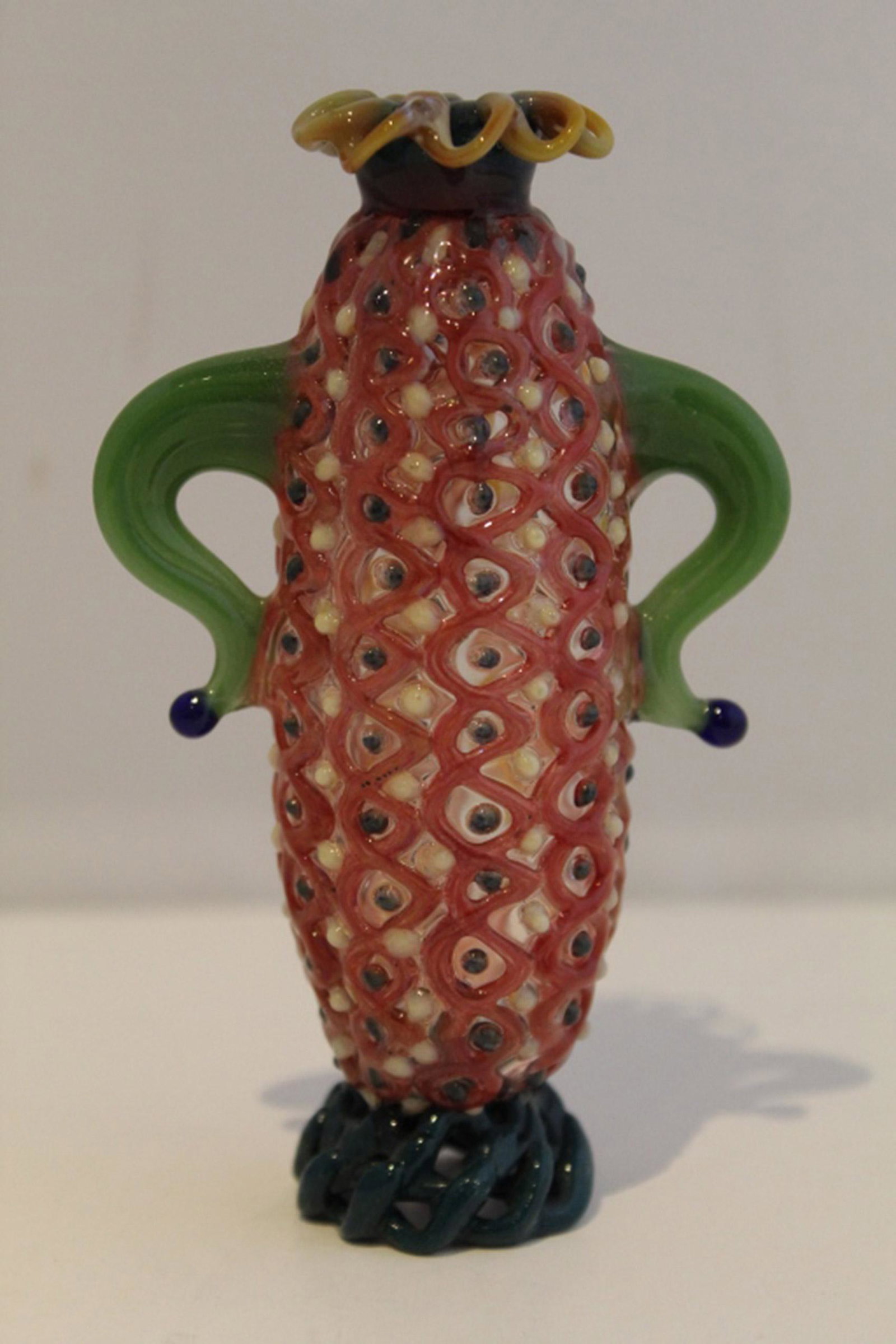 Studio Lampwork Art Glass Bud Vase: Multi colored glass with green handles. Open weave work collar and base. Excellent condition. 4.5" H.