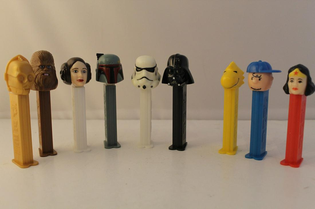 Star Wars & Other Pez Despensers: Includes 6 Star Wars characters, Charlie Brown, Woodstock, and Wonder Woman. All in good condition. 9 total.