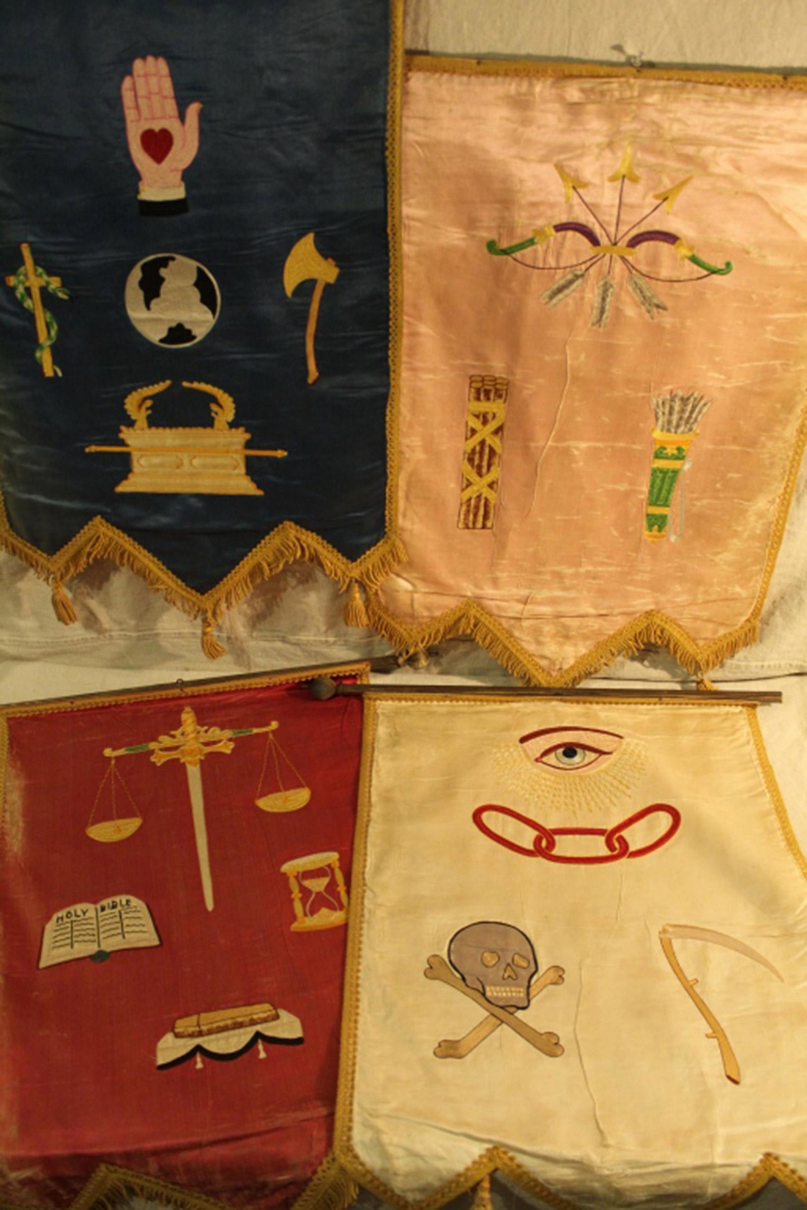 Odd Fellows Silk Embroidery Emblematic Banners: Group of four Early 20th Century Odd Fellows silk, applique and machine embroidery emblematic banners. In good vintage condition with some areas of wear, fading and missing finials. Dimension 19"W x 2