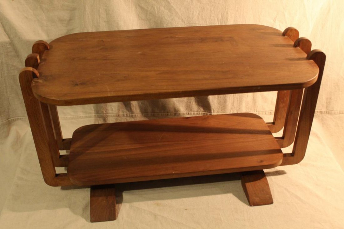 Art Deco / Streamline Moderne Coffee Table: Solid walnut construction in the style of Gilbert Rhode. Good unrestored condition; minor spots and signs of use to top, small section missing to top of one upright. 1920's/ 30's. 17.5" H x 33" W x 18