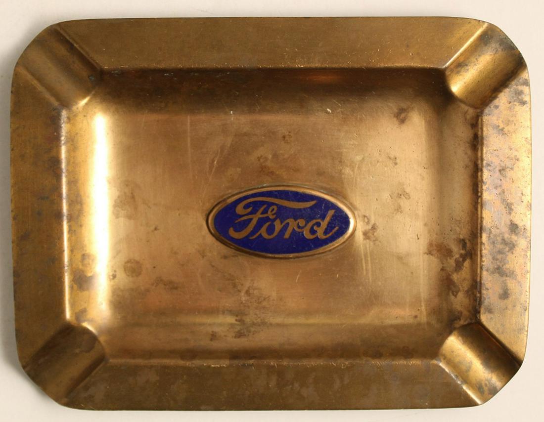 Vintage Bronze & Enamel Ford Advertising Ashtray: Bronze with applied Ford logo with blue enamel. Good condition with signs of normal use, age, etc. 6.5" x 5".