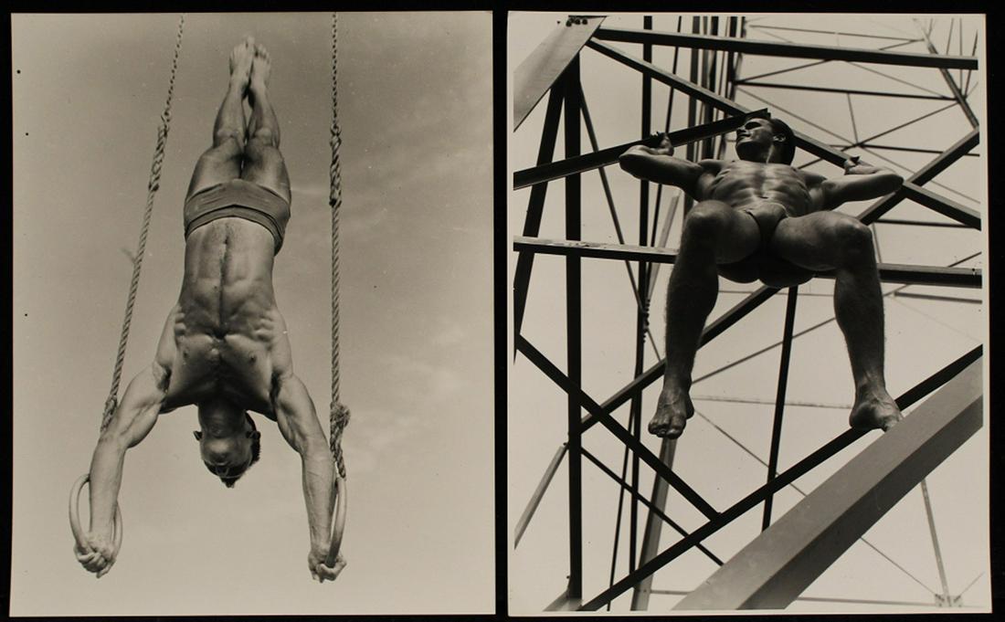 AMG Bob Mizer Male Semi Nude Photographs: (1) Gymnast model performing a handstand on rings. Possibly a later AMG Studio print (60's/ 70's) with some inclusions in the negative; otherwise clear image on gloss paper. 8" x 10". (2) Possible AMG