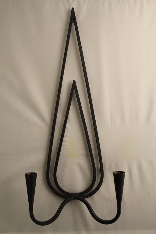 Mid Century Black Wrought Iron Candle Sconce: Mid century black wrought iron candle wall sconce. In good vintage condition. Dimension 8"W x 3 1/2"D x 20"L.