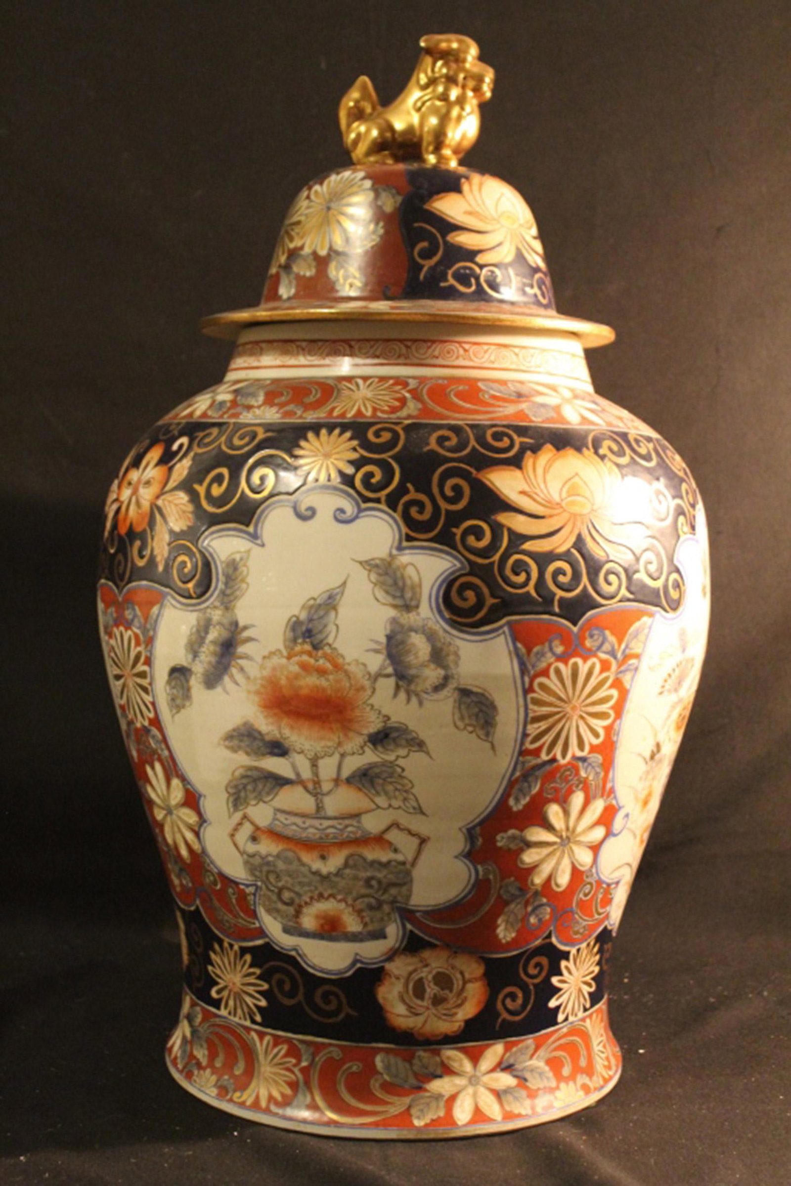 Large Imari Style Covered Jar: Large Imari style covered jar made in Taiwan and hand painted in Hong Kong. In good condition with no cracks or chips. Dimension approximately 14" diameter x 25"H.