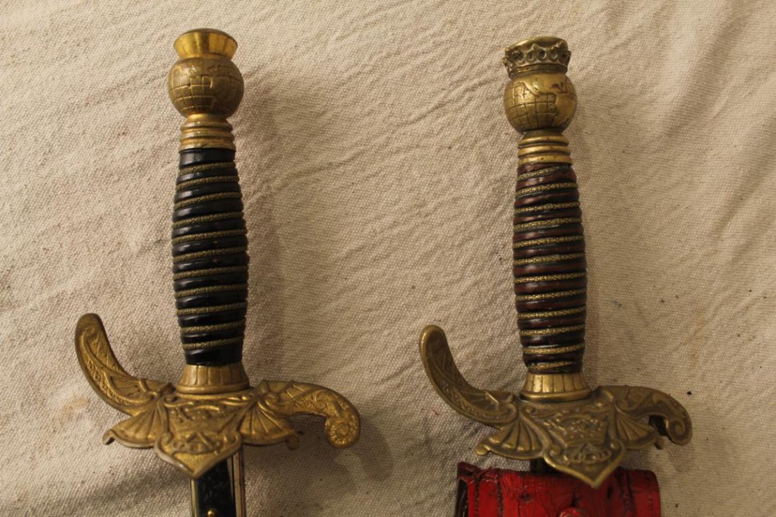 Odd Fellows Patriarchs Militant Pettibone Swords: Two 19th century Odd Fellows Patriarchs Militant ceremonial swords with bronze crowned globe grips, triple link logo guards and period scabbards.Etched blades with owners' names. Manufactured by the P