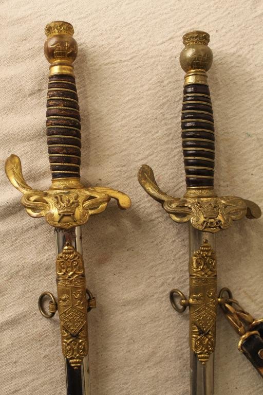 Odd Fellows Patriarchs Militant M. C. Lilley Sword: Group of two 19th century Odd Fellows Patriarchs Militant ceremonial swords with bronze crowned globe grips, triple link logo guards and period scabbards.Etched blades with owners' names. Manufactured