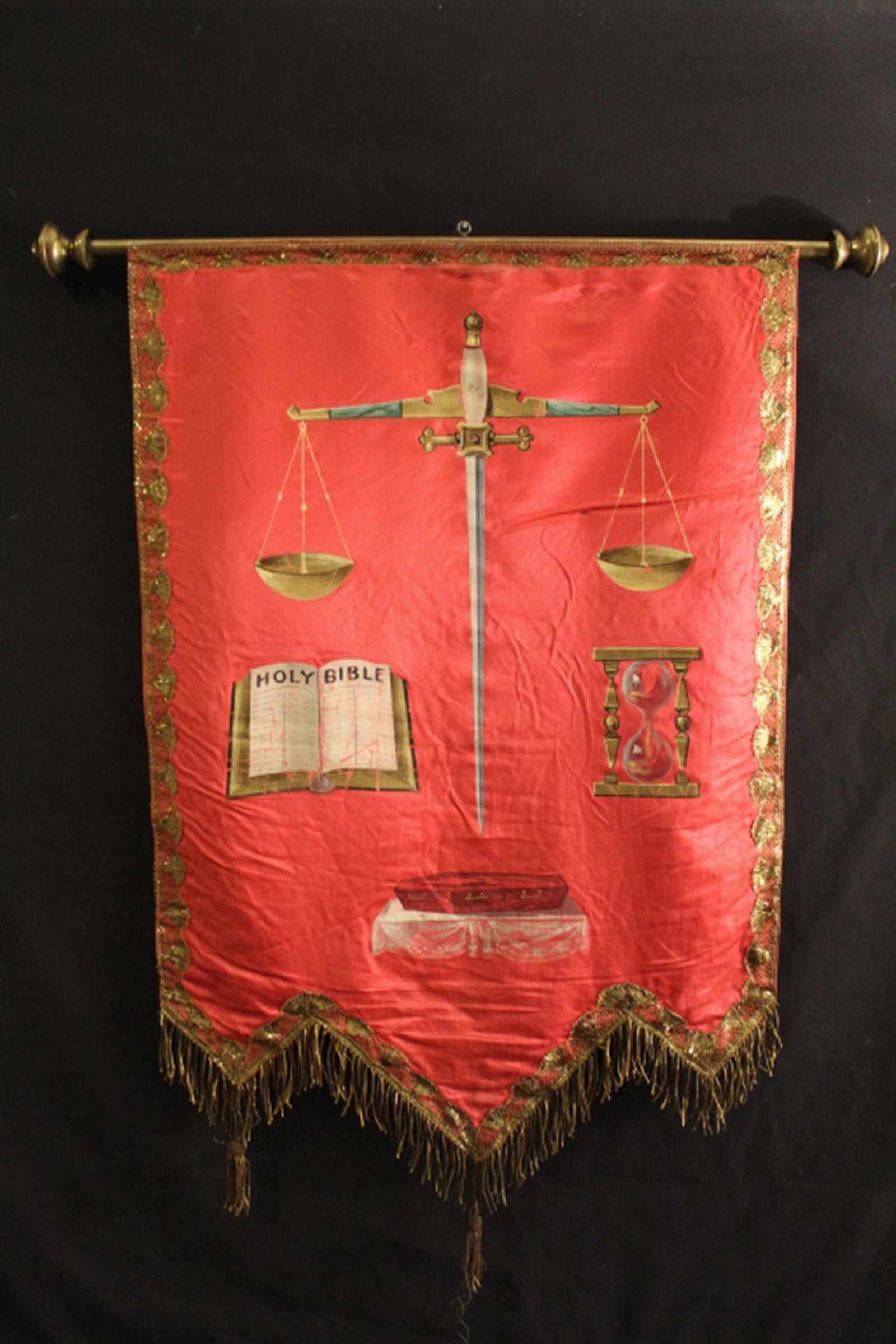 Hand Painted Red Silk Odd Fellows Hanging: 19th Century Odd Fellows hand painted emblematic red silk wallhanging with gilt fringe and images of scales, hourglass, Bible, and coffin. Mounted on brass rod with finials. In good vintage condition 