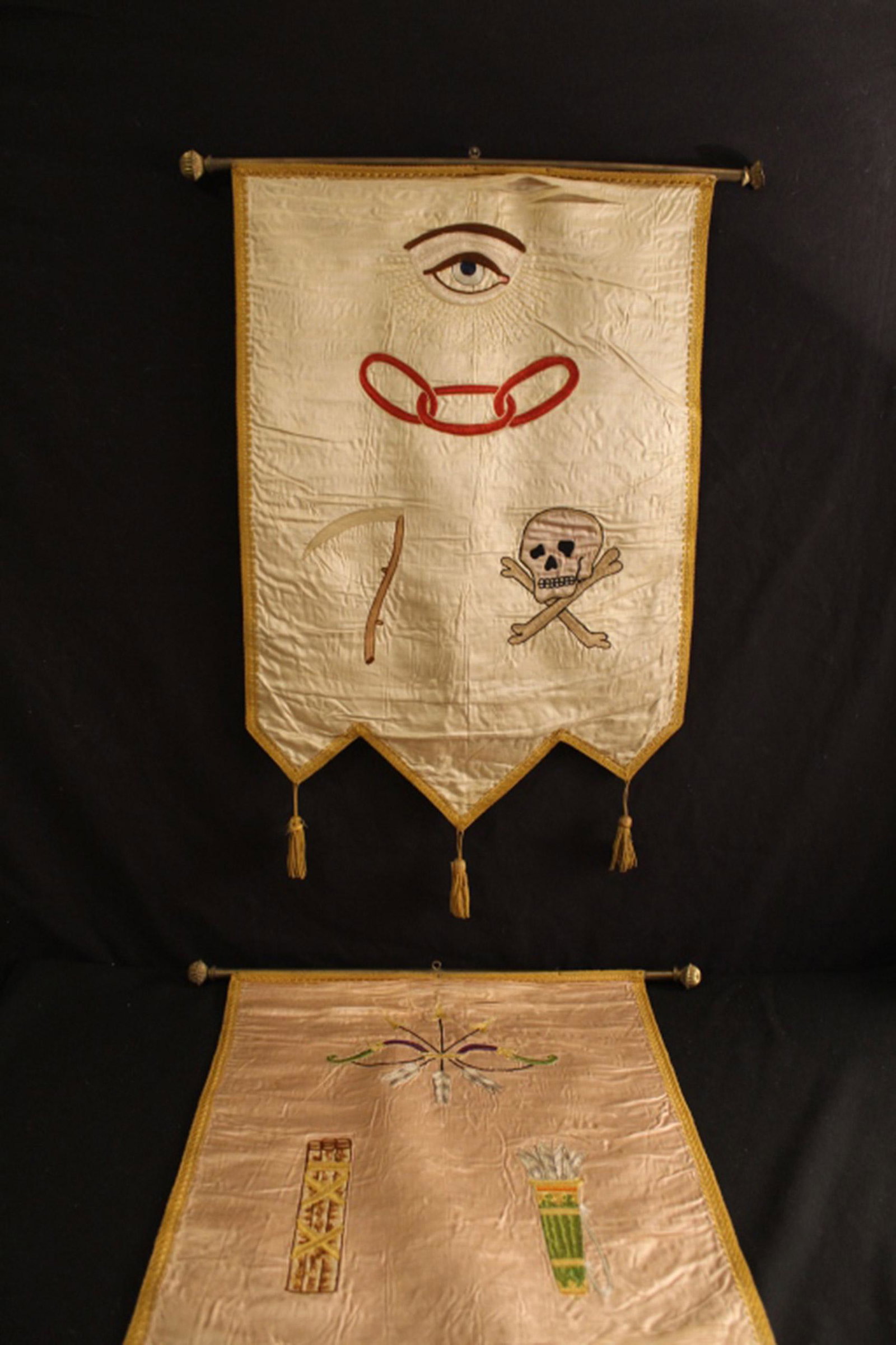 Pair Emrboidered Odd Fellows Silk Hangings: Pair of 19th Century machine embroidered Odd Fellows silk wall hangings. Mounted on brass rod with finials. In fair vintage condition: fraying to silk on both pieces; damage to finials. Dimension 19 1