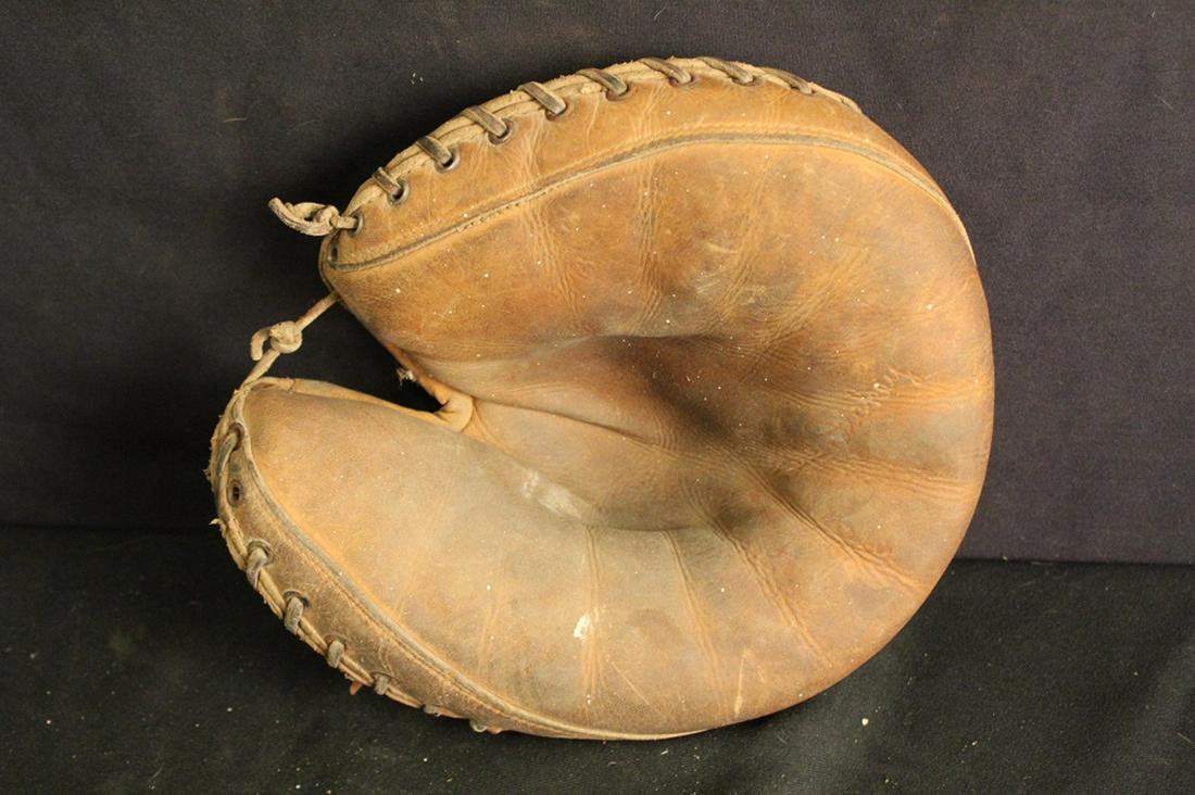 GoldSmith Bill Dickey 1930's Catcher's Glove: 1930's/ 40's GoldSmith baseball catcher's glove with embossed "Bill Dickey" endorsement; Odd Fellow triple link chain on back of glove. In good used vintage condition with moth damage to interior wool