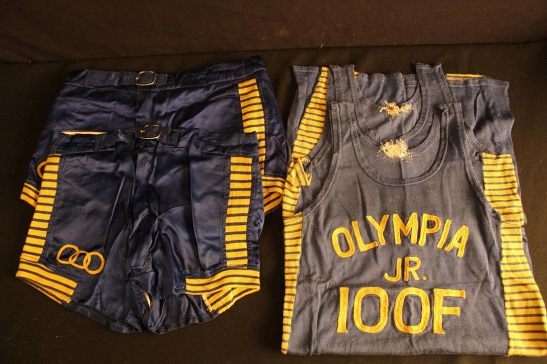 Pair of 1930's Jr Odd Fellows basketball uniforms: Pair of 1930's Jr Odd Fellows basketball uniforms; two pairs of satin shorts and tank tops with machine embroidery: numbers 14 and 19 on back of tank tops. In very good vintage condition. Dimensions: 