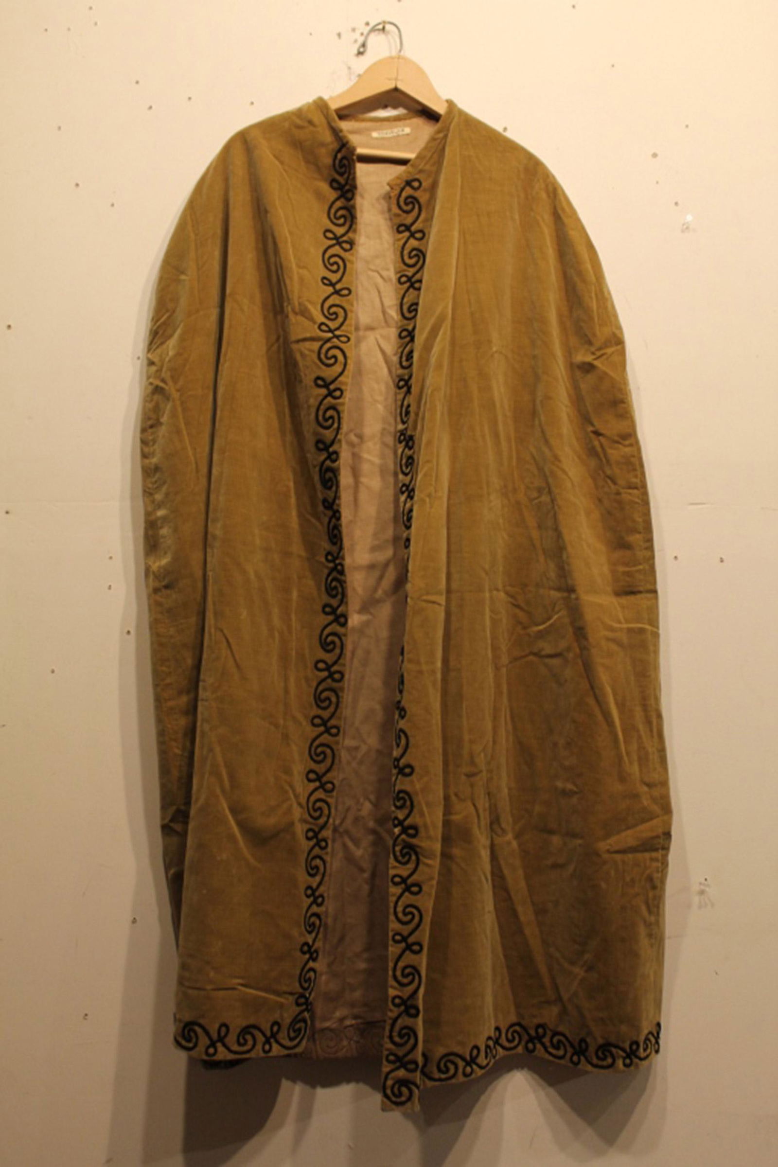 Velvet Odd Fellows Ceremonial Cape: Early 20th Century velvet Odd Fellows ceremonial cape with "Traveler" label and contrasting couched ribbon. In good vintage condition. Dimension 27"W at shoulder x 48"L.