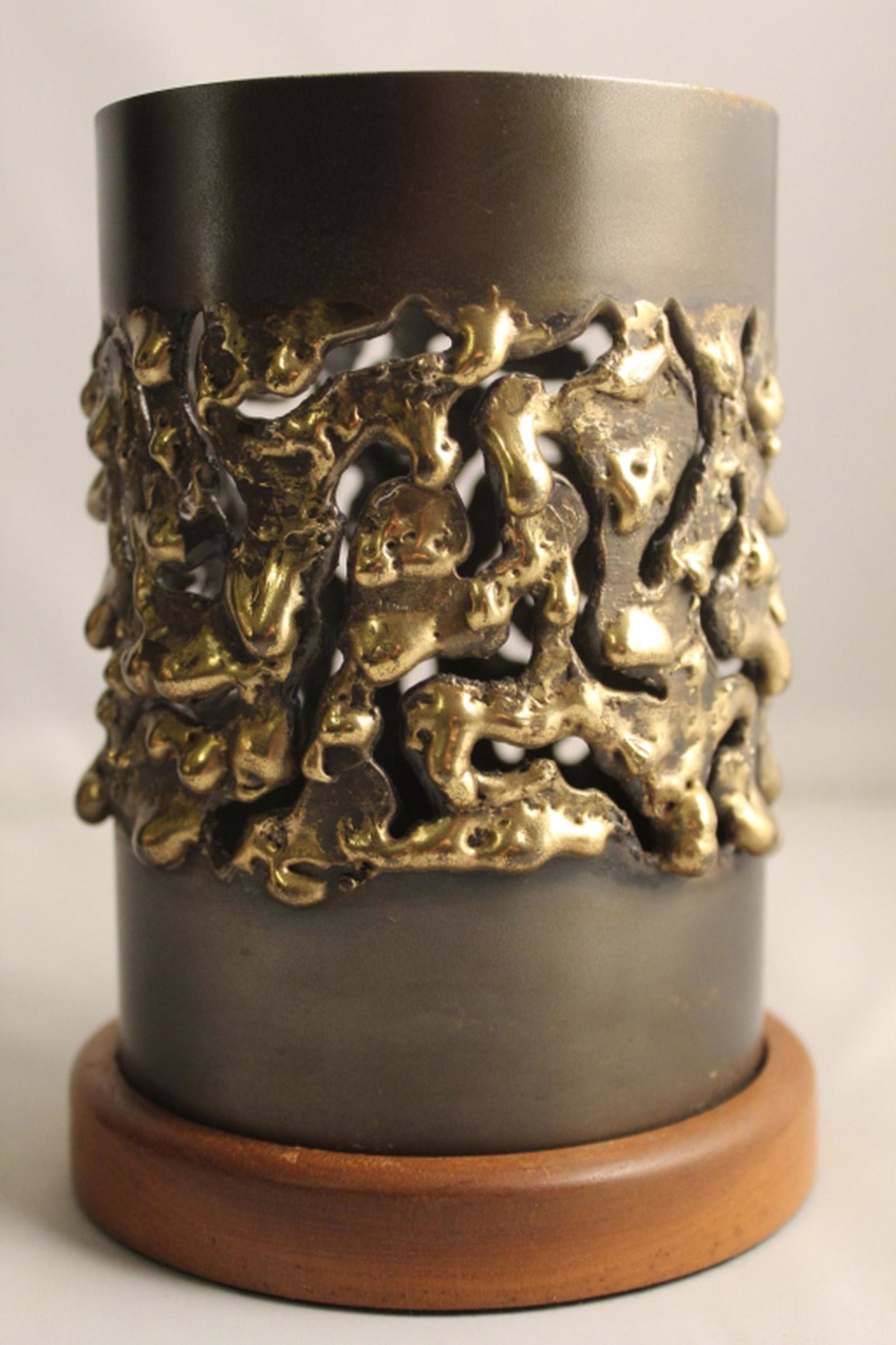 Mid Century Brutalist Candle Shade / Holder: Torch cut steel and brass candle shade / holder in the style of Robert Stanton. Solid walnut base. No apparent signature. Excellent condition. 6 3/8" H (including base). 4" dia.