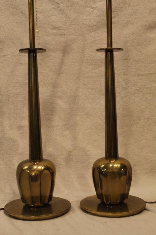 Pair Stiffel Tommi Parzinger Style Brass Lamps: Matched pair mid century style lamps. Good original surface condition with minor dark tarnish/ patina spots (no scratches, dents, plate loss, etc.). Original harps and finials. Replaced sockets. 25" h