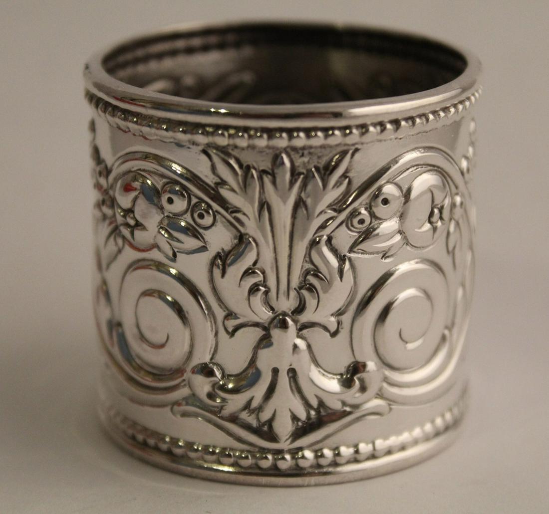 Reed & Barton Sterling Francis I Napkin Ring: New in box with original fabric pouch and pamphlet. Stamped R&B 925. 35 grams approx. 1 5/8" x 1 5/8" dia.