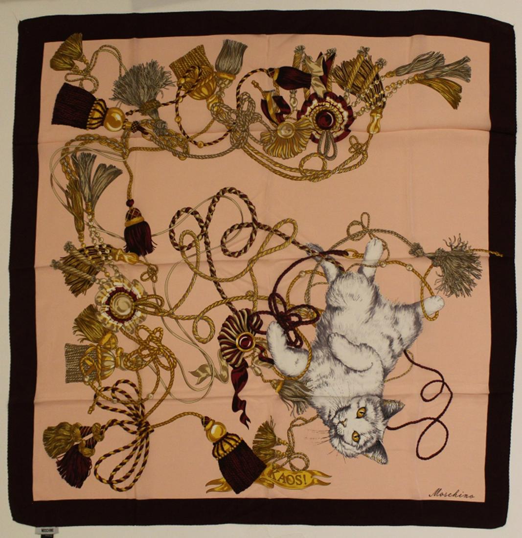 Moschino Kaos Cat Silk Scarf: Vintage Moschino "KAOS!" silk scarf with cat and tassel motif. Hand rolled and stitched edges. Original Made in Itay labels. Very good condition with no apparent snags, pulls, damage, etc. 33" x 32" a