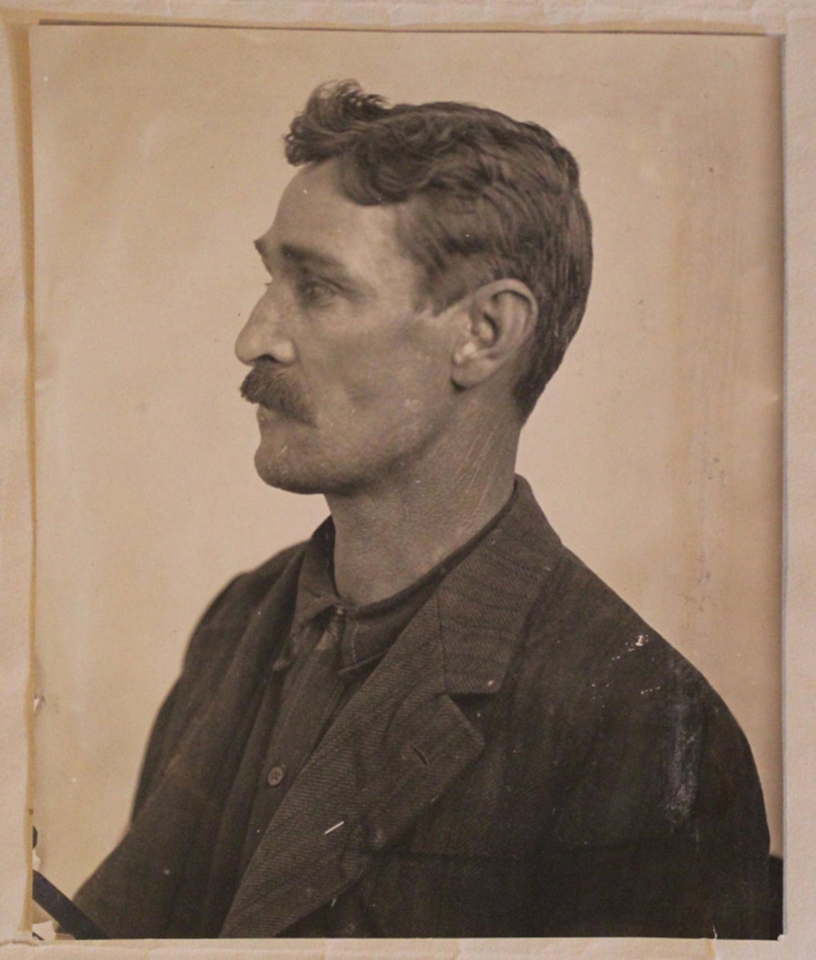 1910 Mugshot Photograph & Sheriff's Office Letter: 3.75" x 3" mugshot photograph of Frank Carpenter attached to typewritten page from John K. Smith, Sonoma County Sheriff. Includes information on Carpenter's physical statistics including scar to eye. 
