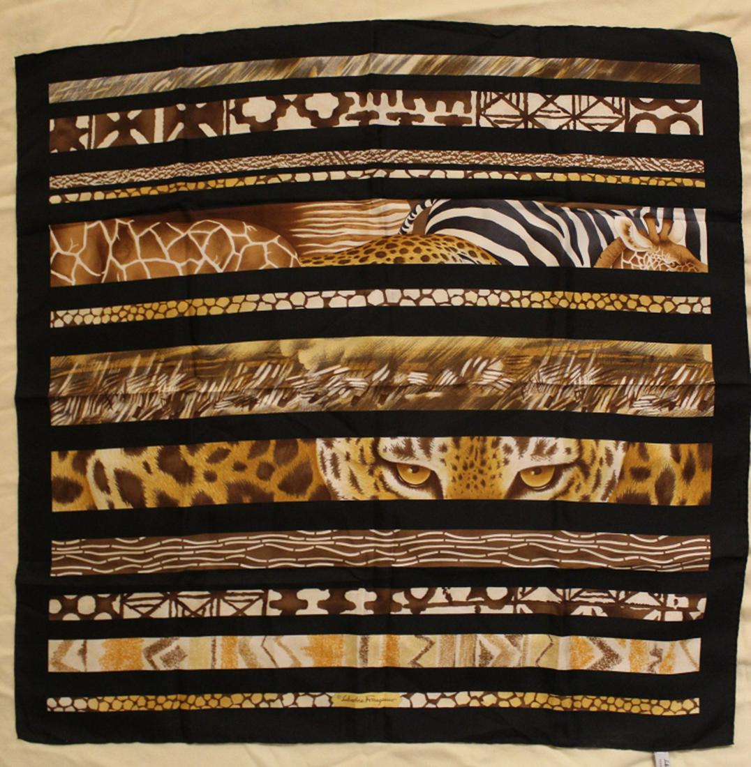Salvatore Ferragamo Animal Print Silk Scarf: Vintage Salvatore Ferragamo jungle animal design. Hand rolled and stitched edges. Original Made in Italy label. Very good condition with bright colors. No apparent snags, pulls, damage, etc. 34" x 35"