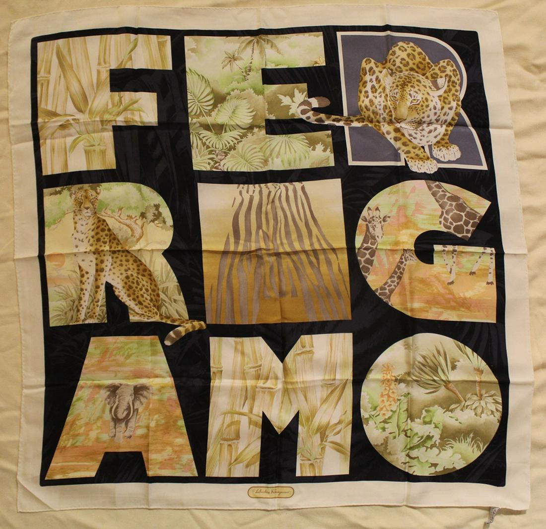 Salvatore Ferragamo Animal Print Silk Scarf: Vintage Salvatore Ferragamo jungle animal in block letter design. Hand rolled and stitched edges. Original Made in Italy label. Very good condition with bright colors. No apparent snags, pulls, damage