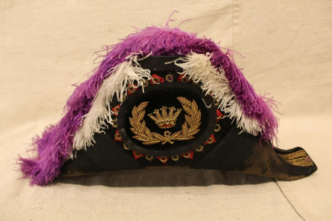 Odd Fellows Patriarchs Militant Commanders's Hat: Odd Fellows Patriarchs Militant commander's hat with purple and white ostriche feathers, and gold bullion embroidered cockades. In good vintage condition with some wear to velvet pile at front and bac