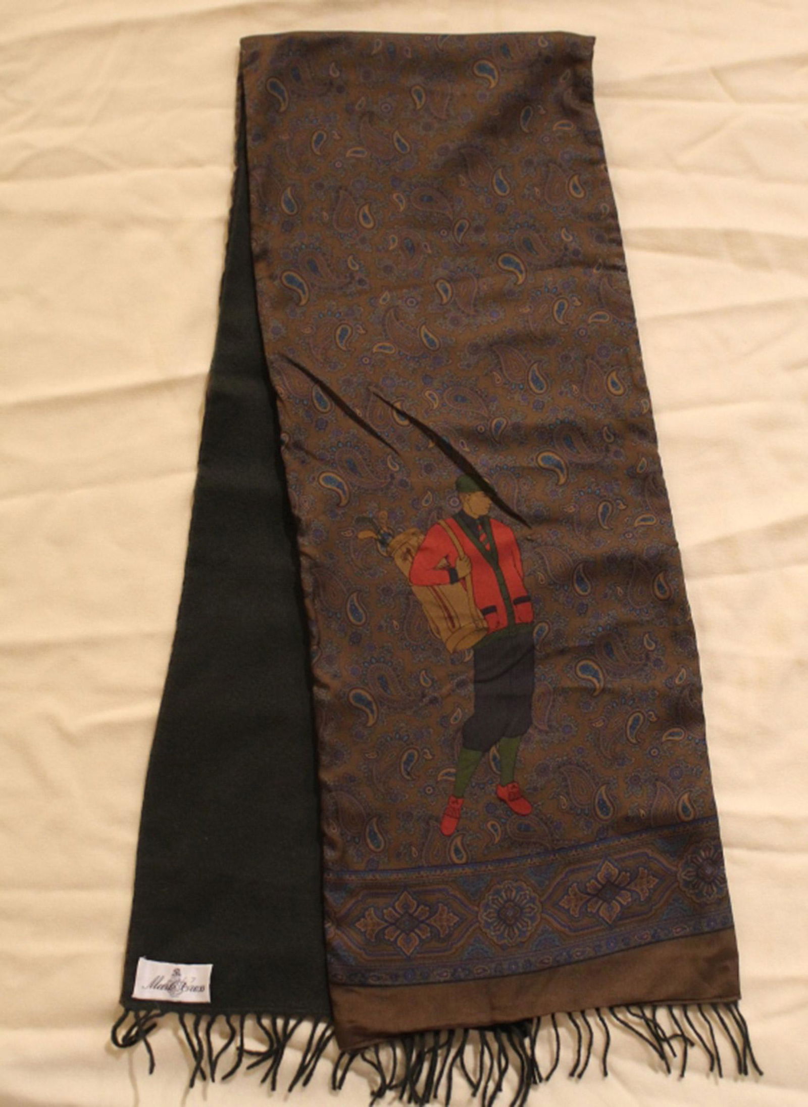 Mark Cross Golf Theme Scarf: Silk with 1920's/ 30's style golfing figures on paisley background; reversible with dark green wool backing. Original Mark Cross label. Very good condition with no apparent snags, pulls, damage, etc.