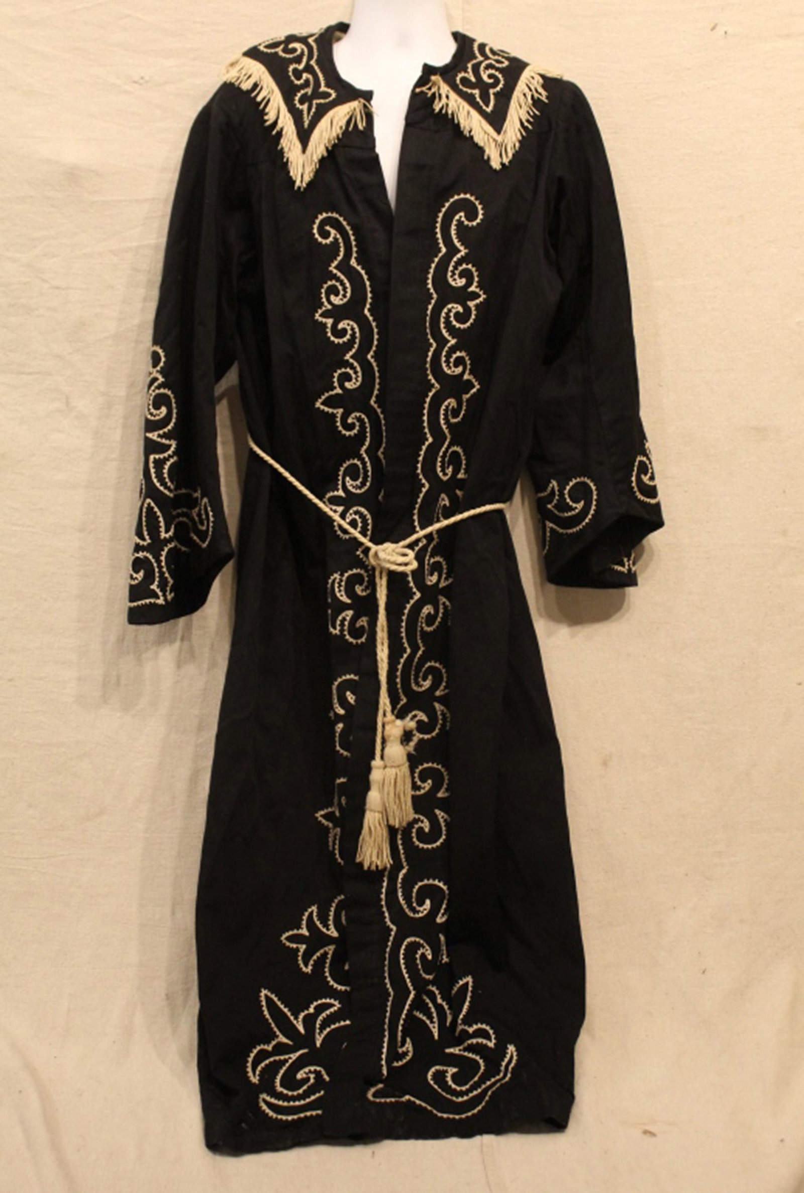 Antique Odd Fellows Conductor Embroidered Robe: Odd Fellows black "Conductor" robe with white machine embroidery. In good vintage condition with several missing buttons. Dimension approximately 55"L x 18"W at shoulder.