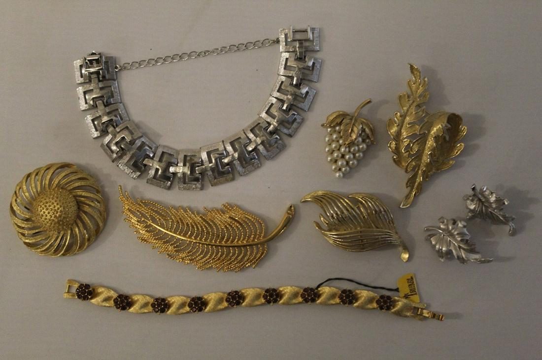 Vintage Monet Lisner Trifari BSK Costume Jewelry: Includes: Monet Greek key bracelet, Monet leaf brooch, two Lisner leaf brooch, Trifari grape brooch, Trifari purple rhinestone bracelet, pair Trifari leaf clip earrings, and BSN flower brooch. All ver