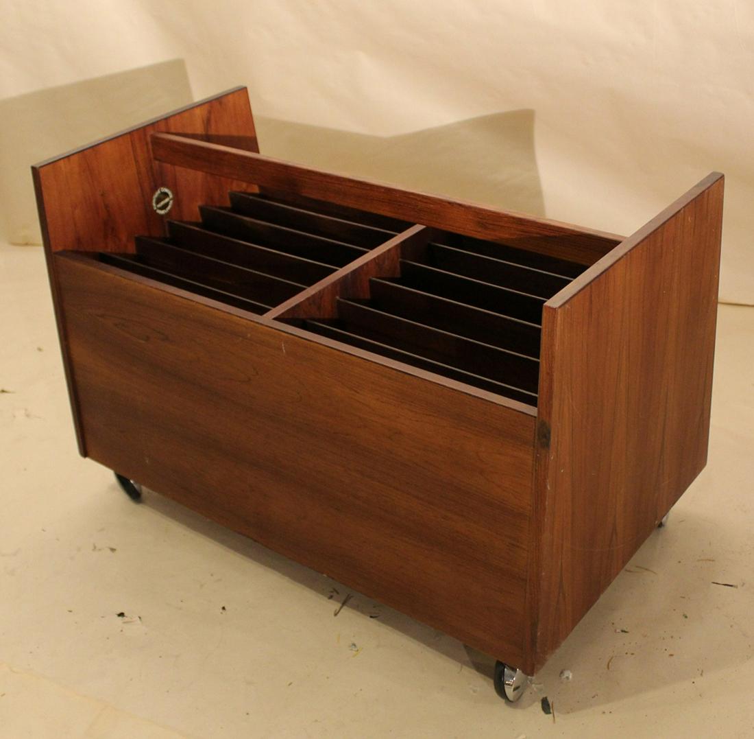 Bagn Mobelindustri Norway Modernist Magazine Rack: Designed by Rolf Hesland. Rosewood veneer with sectioned interior and long handle. Original swivel caster wheels. Bagn Mobelindustri and Norway furnture control labels. Good condition with age related