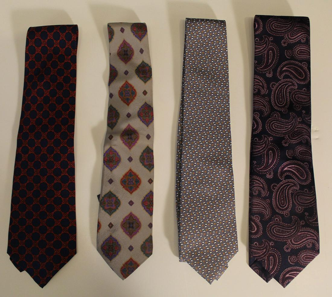 Mixed Group of Four Designer Silk Men's Ties: Group of four deisgner silk men's neckties: Brioni, Burberry,Fendi and Salvtore Feragamo. In "like new" condition; Fendi tie with slightly more use. Dimenson 3" - 3 1/2"W x 56"L.
