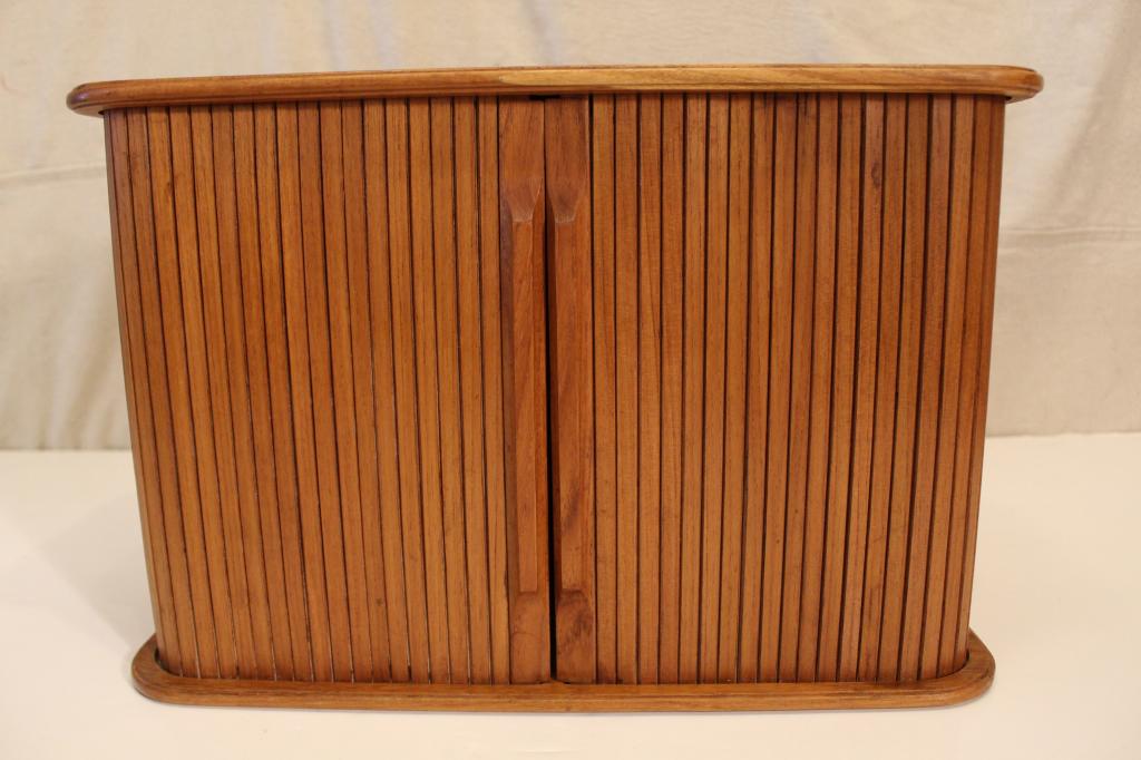 Danish Modern Teak Tambour Wall Cabinet by Eppco: Solid teak and veneer small wall cabinet with 2 tambour sliding doors. Sliding shelf supports. Flush "key hole" wall mount brackets. Stamped Eppco Enterprises Inc Cleveland Ohio Made in Thailand. Very
