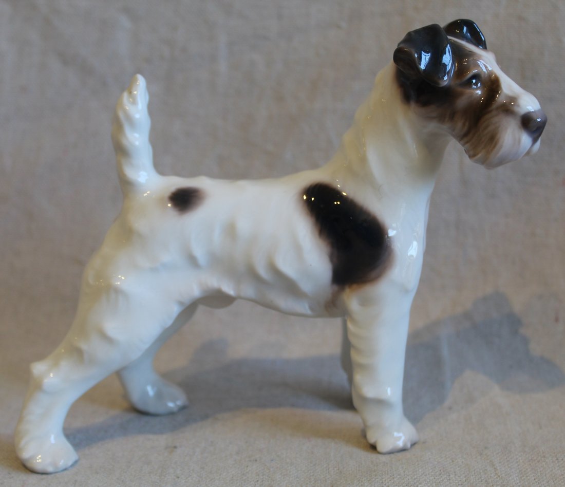 Bing & Grondahl Denmark Porcelain Dog Figurine: Wire fox terrier designed by Dahl Jensen. Marked with Three Royal Towers mark in green, B&G in blue, and 1998 in green. Excellent condition. 5 3/8" H x 6 3/4" approx.