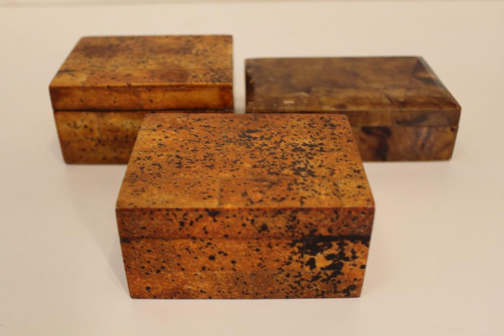Maitland Smith Style Tessellated Horn Desk Boxes: (1) Tessellated horn veneer box with brass hinges. 5" W x 3 1/3" D x 1 5/8" H. (2) Pair tessellated horn (possibly bone) veneer boxes stamped Made in Austria. 4 1/4" W x 3 1/8" D x 2 1/8" H. All excel