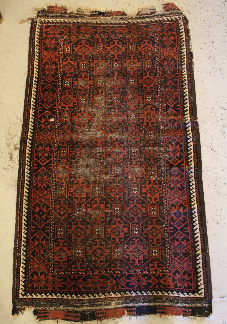 Antique Afghan Belouch Hand Knotted Rug: Wool on wool with repeating medallion field. Areas of pile wear, a few small holes, wear/ tears and some losses to ends, etc. Late 19th/ early 20th C. 2' 9" x 5' 1" approx.
