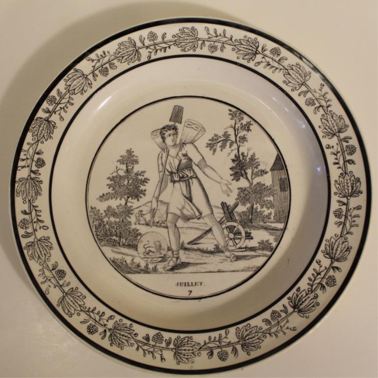 Paillart & Hautin Choisy-le-Roi Creamware Plate: "Juillet" creamware plate decorated with black transfer image of an ancient farmer as an allegory representation of July. Marked to the underside with an impressed P&H Choisy in a shield,1824-1836. Ex