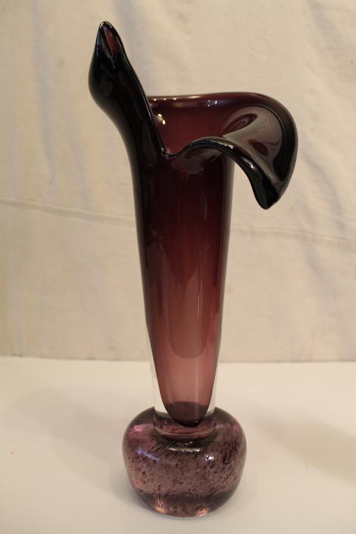 Bertil Vallien / Kosta Boda Style Art Glass Vase: Hand blown cased amethyst glass vase with base rolled in crushed amethyst glass particles. No apparent signature. Excellent condition. 15.75" H.