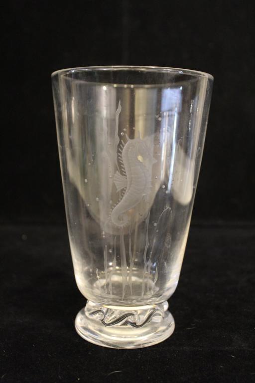 Steuben Engraved Seahorse Clear Glass Vase: Wheel cut etched Art Deco/ Art Moderne seahorse design. Etched Steuben signature. One tiny flea bite nick to base edge; otherwise excellent condition. Mid 20th C. 7.25" H x 4.5" dia.