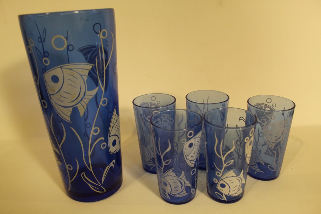 Hazel Atlas Cobalt Cocktail Shaker / Juice Glasses: Includes 8 1/4" cobalt glass cocktail shaker and 5 small 3 3/4"juice glasses, all with angel fish design. Good to fair condition.