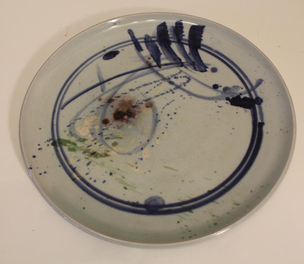 Artist Signed Studio Art Pottery Charger Plate: Japanese style with under glaze blue with multi coloed details. Artist's script signature to underside. Excellent condition. 14" dia.