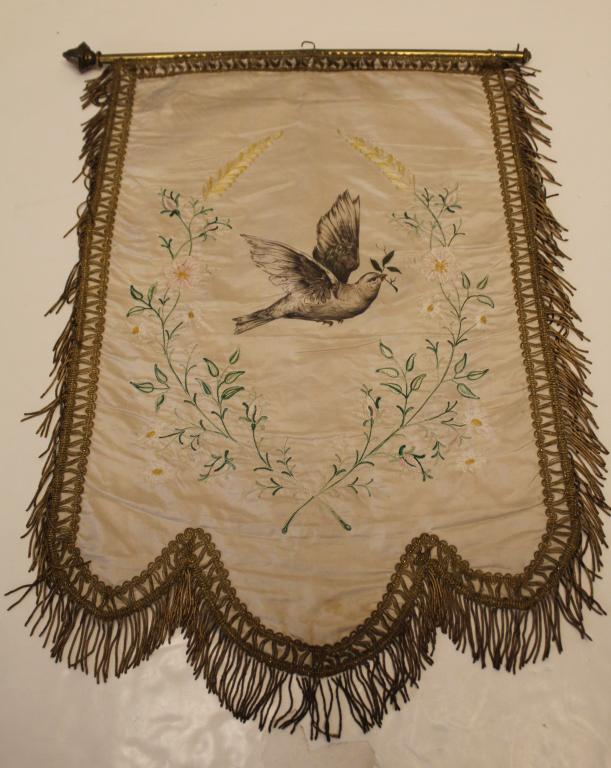 Antique Odd Fellows Silk Banner: Hand painted dove with machine embroidered flower on cream silk. Gold metal trim and fringe. Brass rod (23.5") missing one finial. Good condition with signs of age, etc. 31" x 19.5".