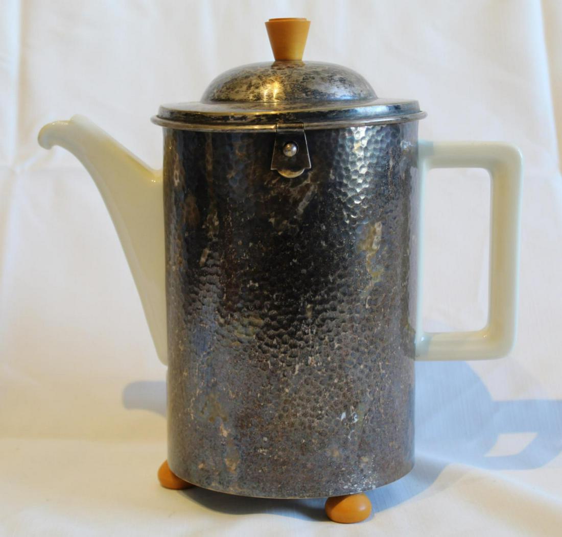 Deco WMF Cozy & Bauscher Weiden Coffee Pot: WMF hammered silver plate insulated coffee pot cozy with hinged lid. Bakelite knob and three feet. Marked WMF 1,4 L D.R.P. Very good original condition; tarnish to surface. 9 3/8" x 5 3/8" dia. approx