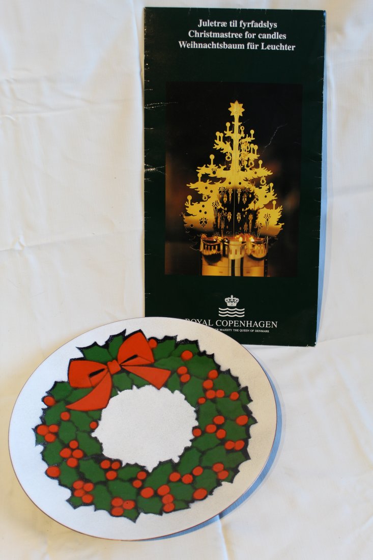 Royal Copenhagen Candle Tree & Enamel Dish: (1) Royal Copenhagen Denmark brass candle tree decoration designed by Jette Frolich. Unused; some wear to folder. (2) Annemarie Davidson enamel on copper wreath plate. Excellent like new condition. 11