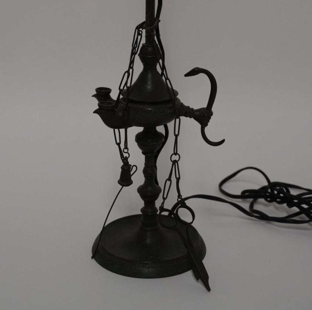 Bronze Grand Tour Souvenir Roman Oil Lamp: Double wick lamp with hand holding snake handle. Includes snuffer, wire pick, and wick scissors on chains and hand shaped finial. Electrical wire to exterior; original assemblage drilled with hole to