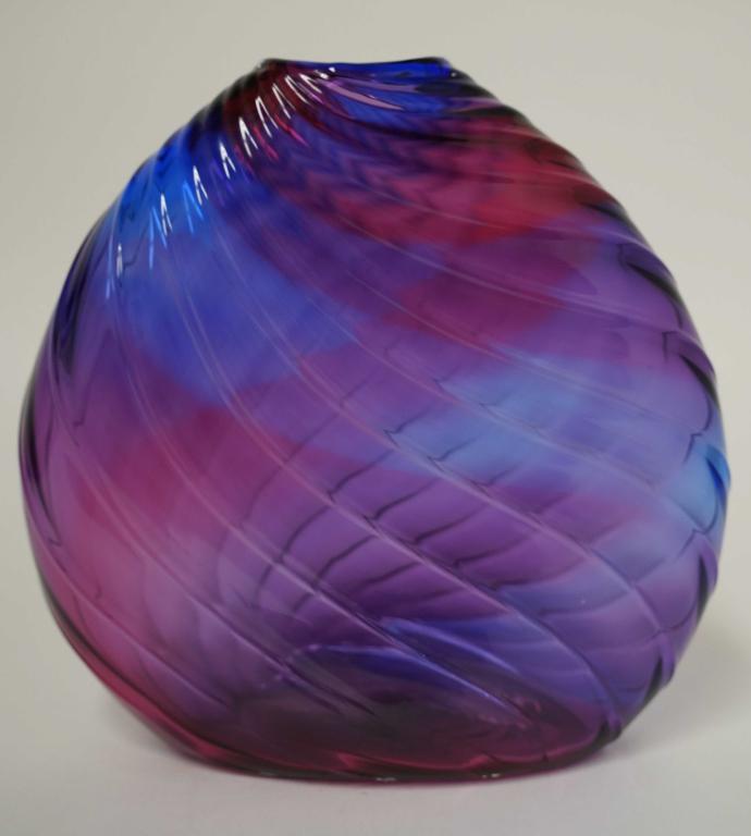 Dan Bergsma (Wa.) Studio Art Glass Vase: Amethyst and blue pillow glass with twisted ribbed surface. Etched signature with 557 D to bottom. Excellent condition. 11" H.