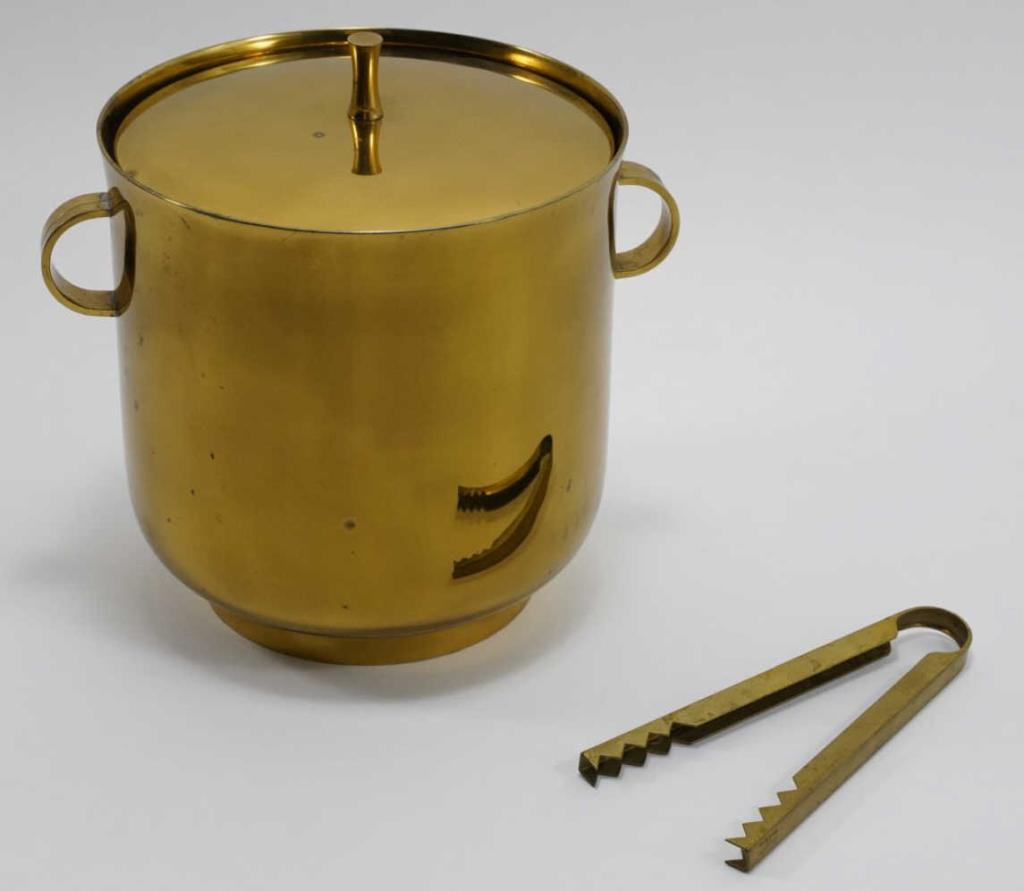Tommi Parzinger Brass Ice Bucket by Dorlyn: Brass with mercury glass insert. Very good condition with some minor oxidation spots, etc. Stamped mark to bottom. No dents or damage. Includes brass ice tongs stamped "Made in Italy Exclucively for B
