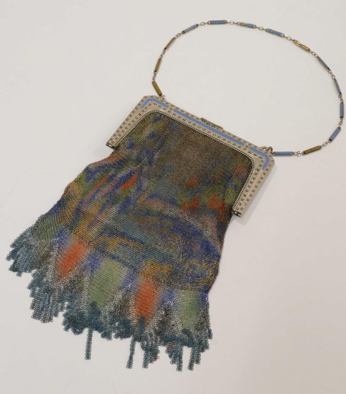 Whiting & Davis Art Deco Mesh Purse: Frame set with marcasite and enameled details. Link chain handle (loss of enamel to some links). Mtal mesh bag portion with multi colored abstract design. Original silk interior; tear, signs of use, e