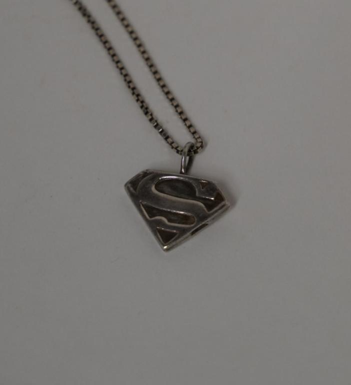 Sterling Superman Locket Pendant Necklace: Pendant stamped TM DC and 925; 3/4" x 7/8". Includes 25" box chain marked 925 Italy. 12 grams total approx.